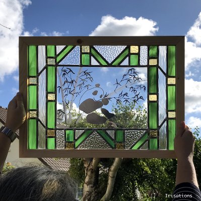 Panda and bamboos asian stained glass window. Stained glas class. Paris, Versailles, France.