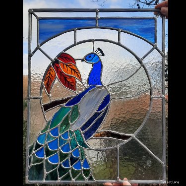 Art Nouveau peacock stained glass window